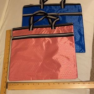 2 envelopes with zippers. Not sure what material